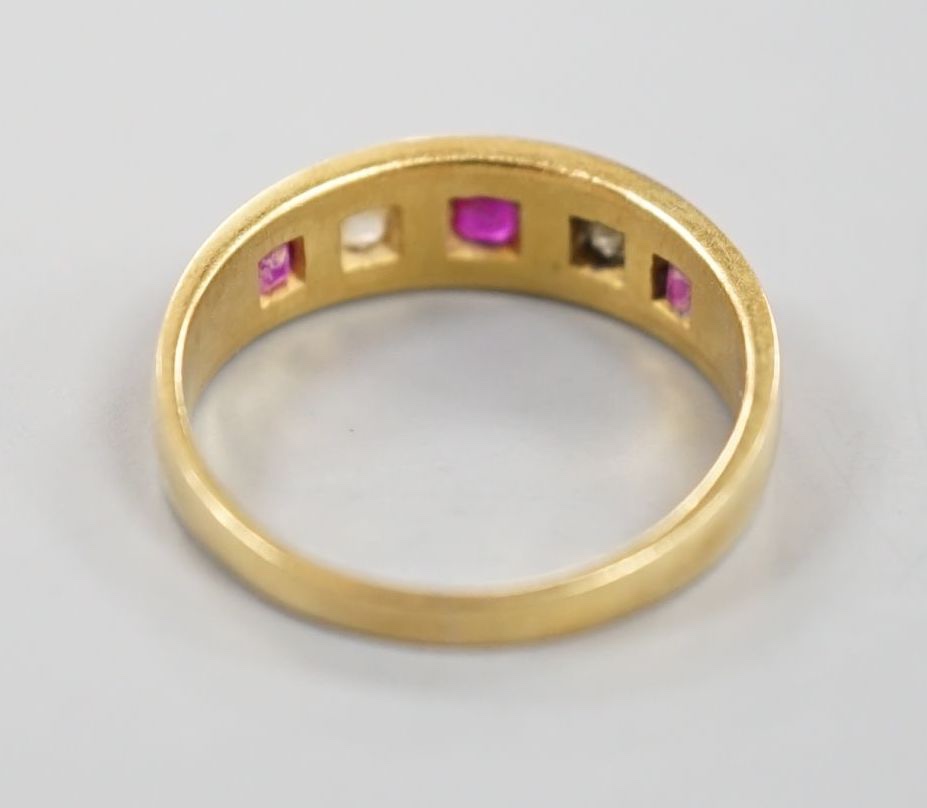 An early 20th century yellow metal and gypsy set three ruby and two stone diamond ring, size P, - Image 4 of 4