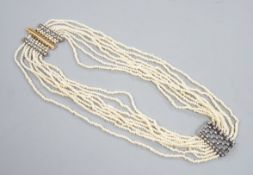 A 19th century multi-strand seed pearl choker necklace with yellow metal and rose cut diamond set