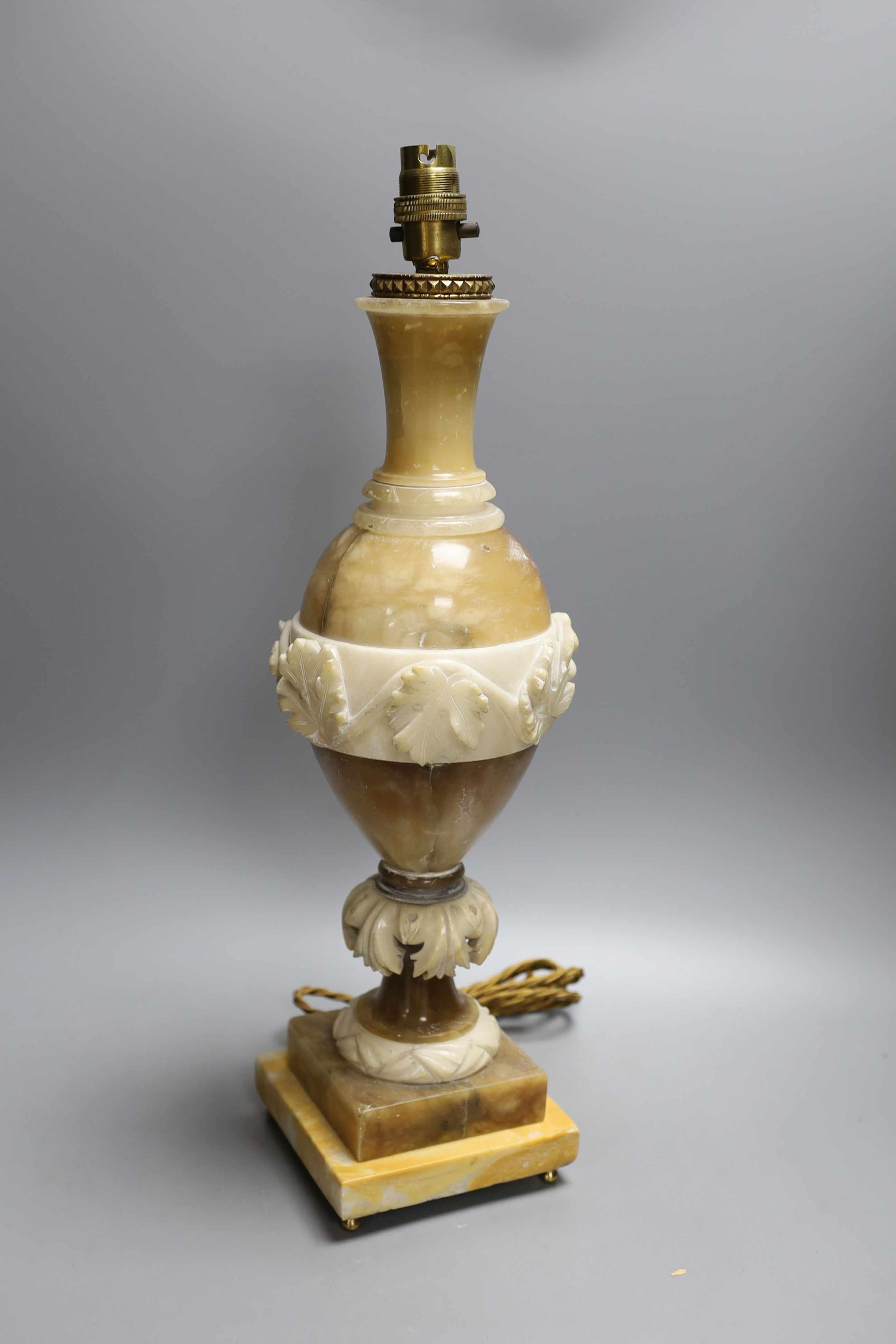 A carved alabaster table lamp