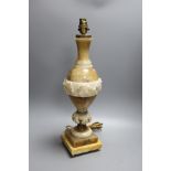 A carved alabaster table lamp