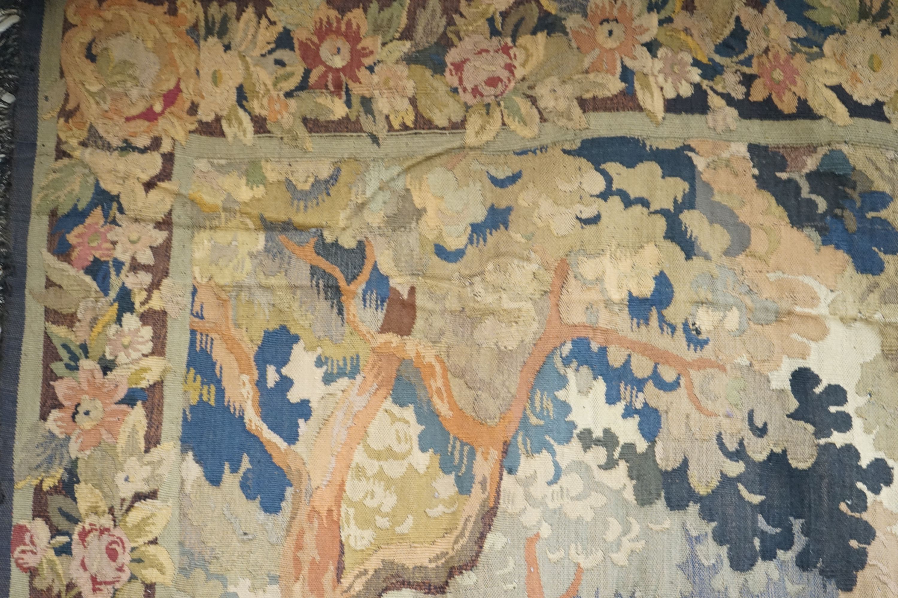 A late 19th / early 20th century French tapestry depicting a woodland scene with trees and flowers - Image 2 of 9
