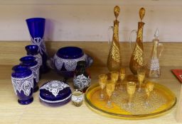 Selection of lace-pattern coloured glassware including an amber liqueur set