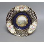 A 19th-century Meissen pierced dish painted with a titled view ‘Hohenstaufen und Rechberg’ - 23cm