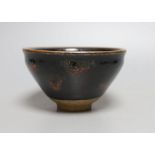 A Chinese black and red pottery bowl - 7.5cm tall