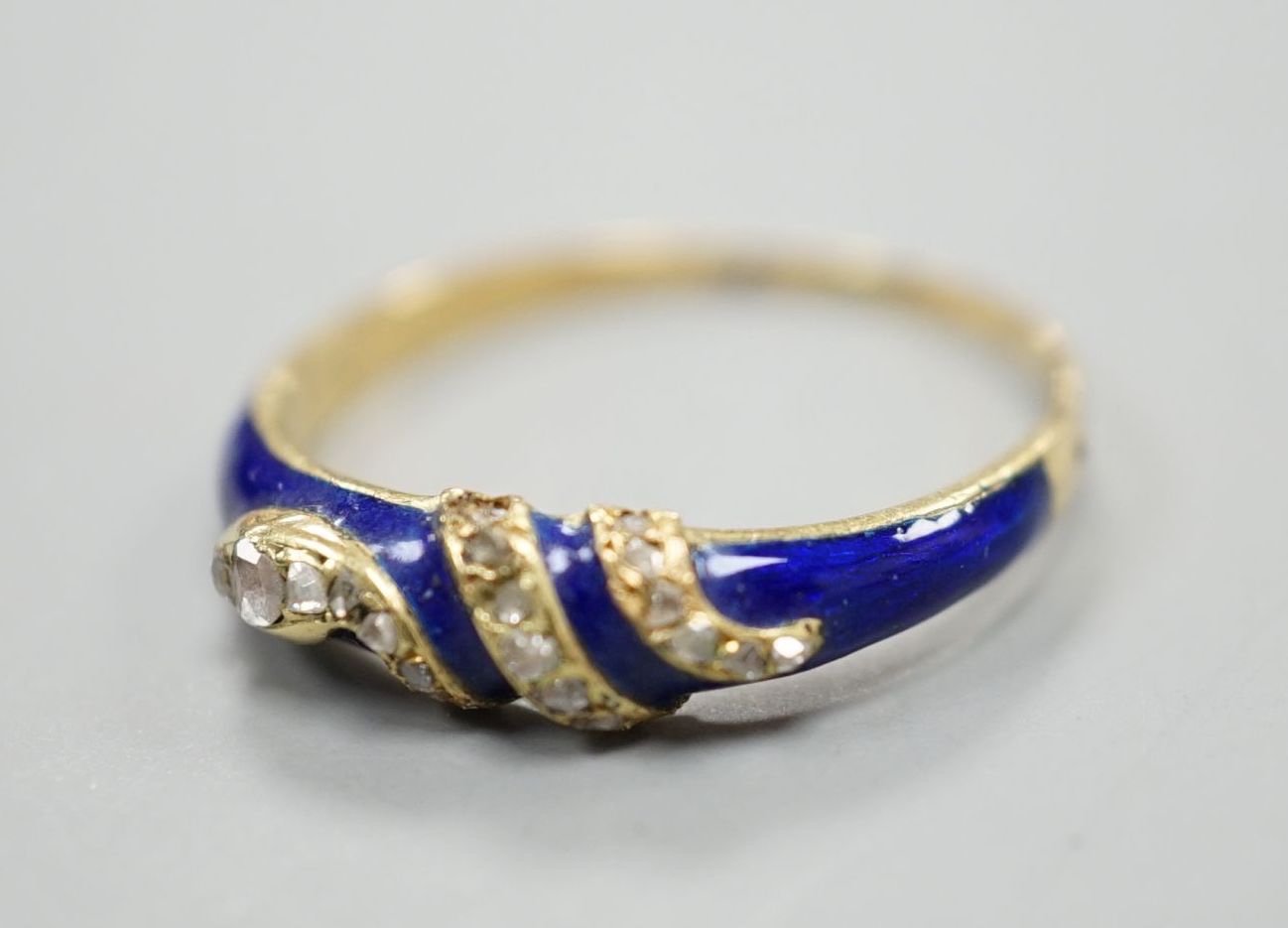 A late Victorian yellow metal, blue enamel and rose cut diamond set serpent ring, size O, gross - Image 2 of 4