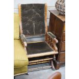 An early 20th century American upholstered mahogany rocking chair, width 58cm, depth 52cm, height