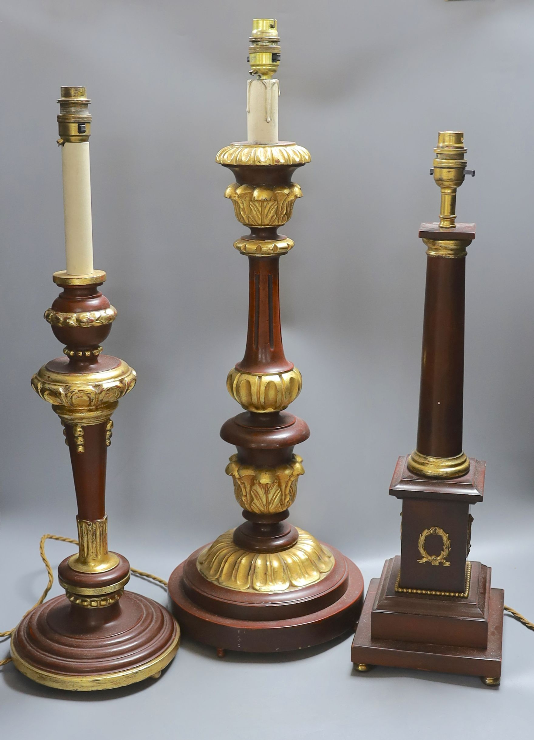 Three parcel gilt wood table lamps - tallest 64cm