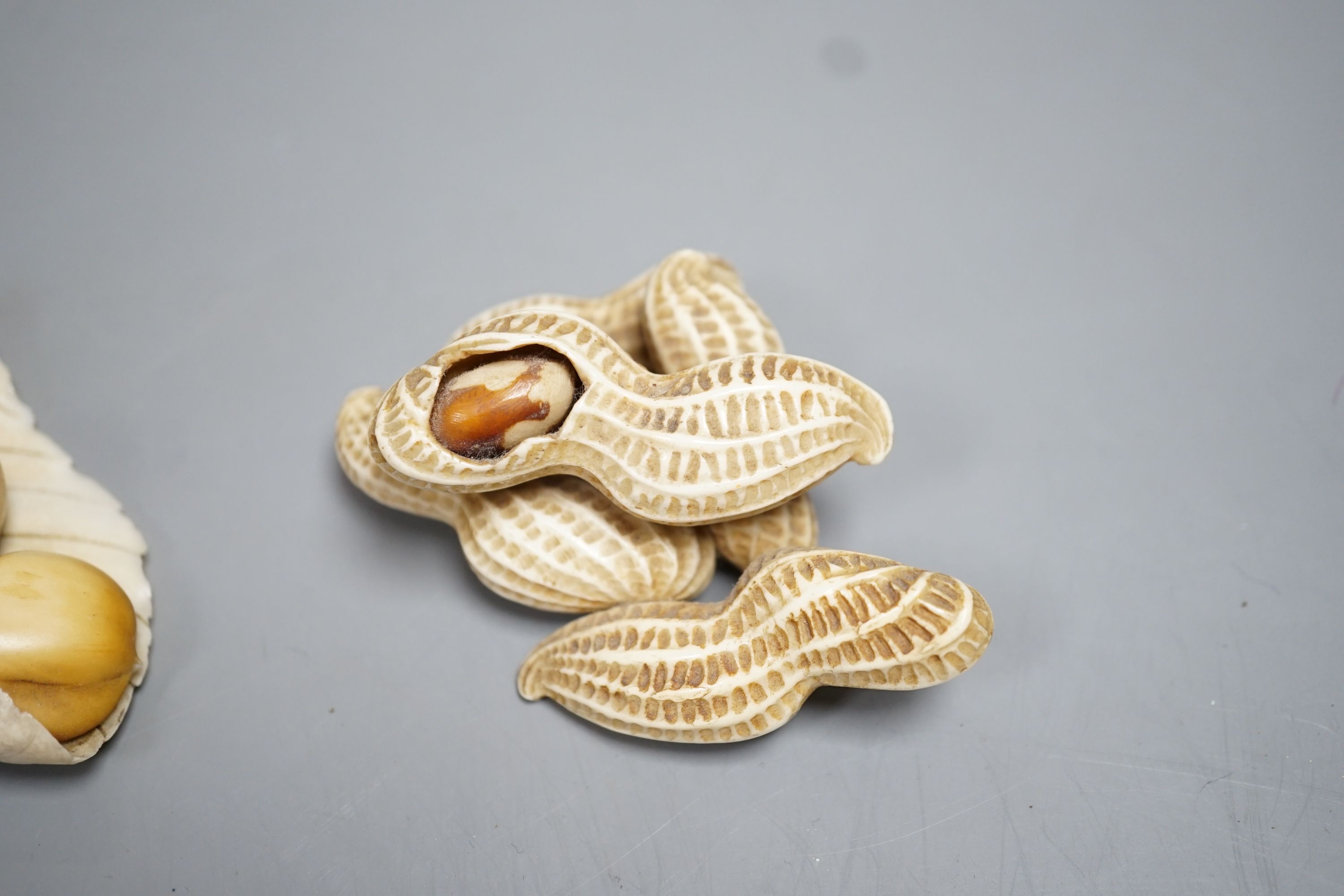 Two Japanese Ivory models of group groups of nuts, first half 20th century, largest 11cm - Image 3 of 7