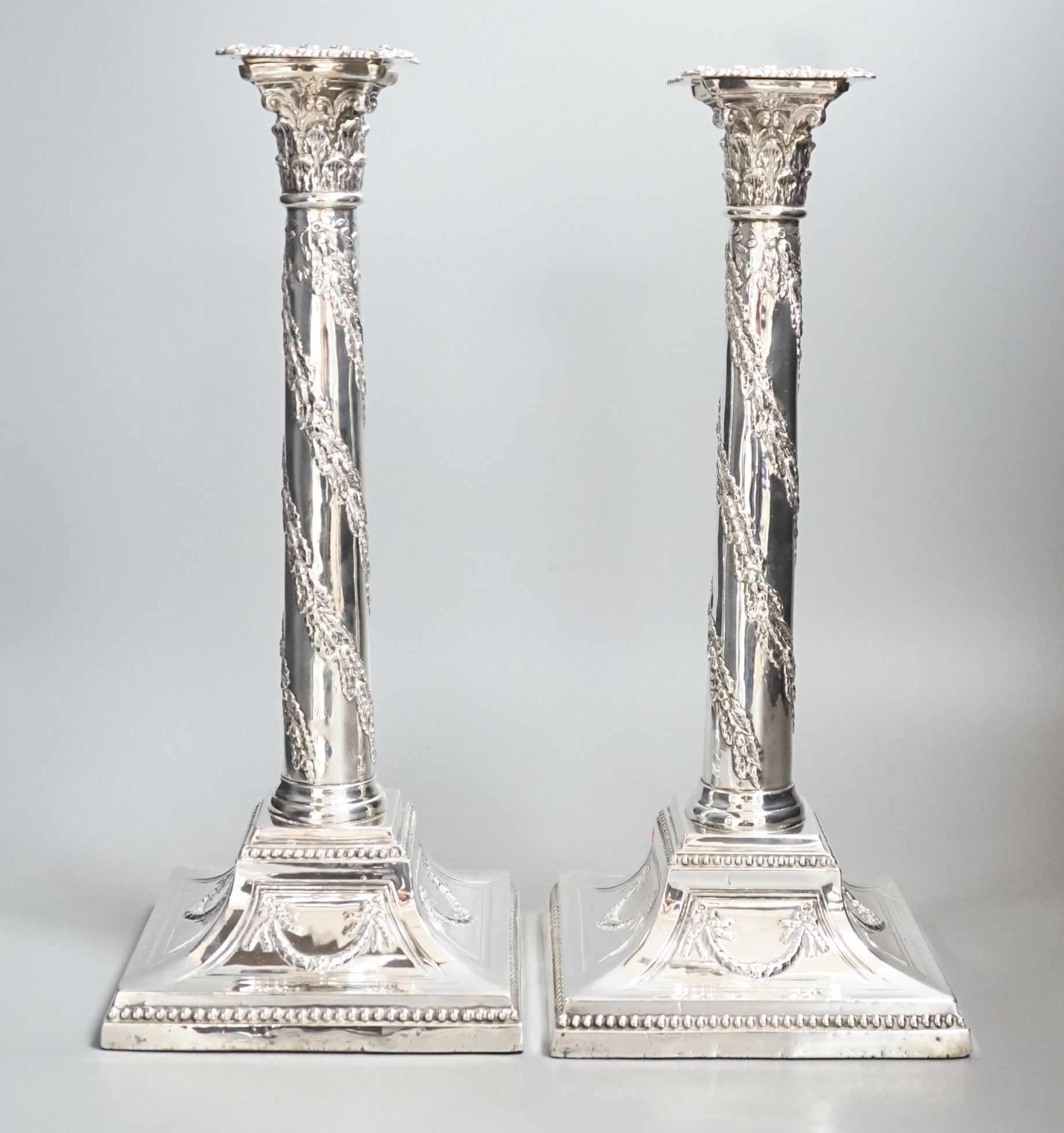 A pair of George V silver Corinthian column candlesticks, with spiral harebell columns, Ellis & - Image 2 of 3