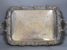 A large electroplate two handled tray, with pierced and vine decoration, 51 cms wide not including
