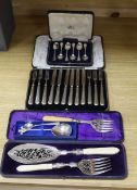 A cased pair of servers, and serving fork, cased silver coffee spoons, royal commemorative spoon,