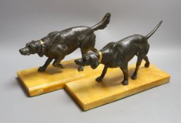 A pair of bronzed spelter dogs on base - 29cm long