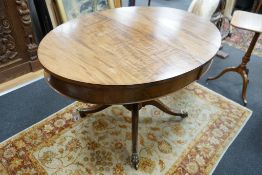 A small George III style oval mahogany extending dining table, (no leaves) width 126cm, depth