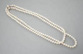 A Portuguese double strand cultured pearl necklace, with diamond set 800 finesse white metal