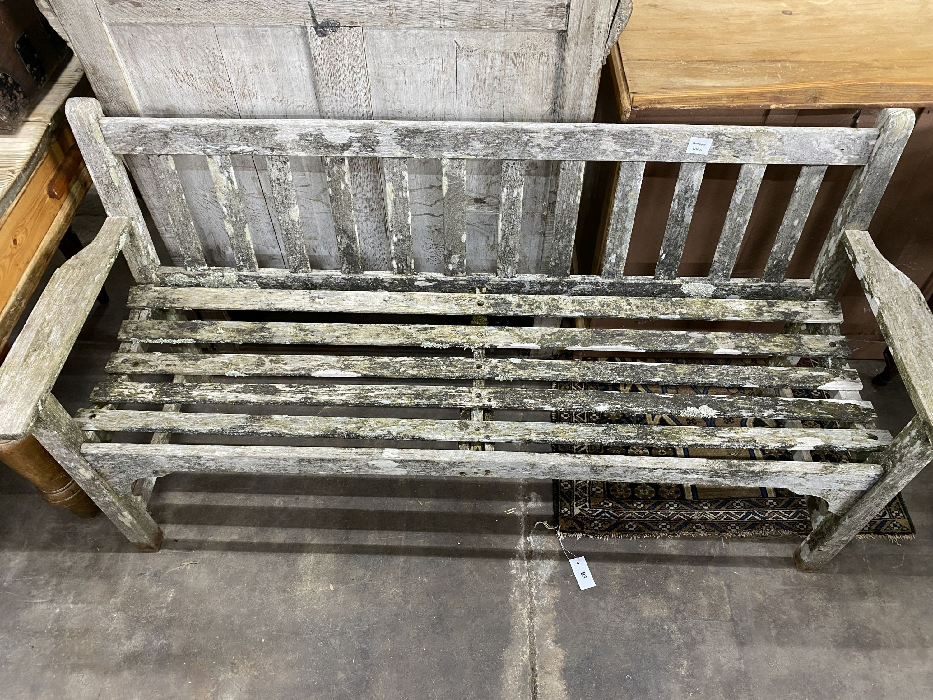 A weathered teak slatted garden bench, length 160cm, depth 54cm, height 82cm - Image 2 of 2