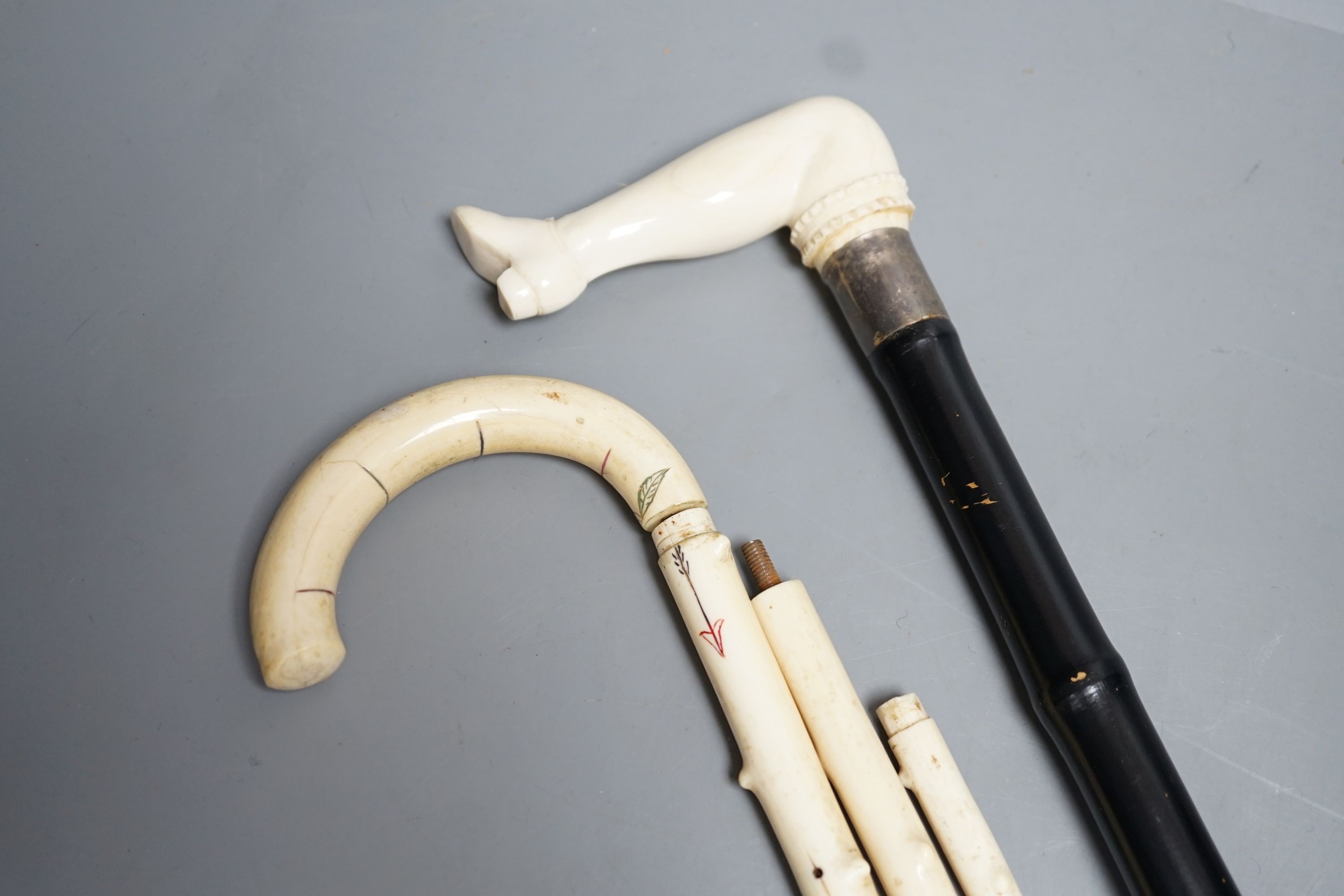 A silver mounted ivory handled ‘leg and shoe’ walking cane (88cm) and a sectional ivory walking - Image 2 of 6