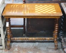 A Victorian inlaid rectangular walnut games table with chess and backgammon surface, width 87cm,