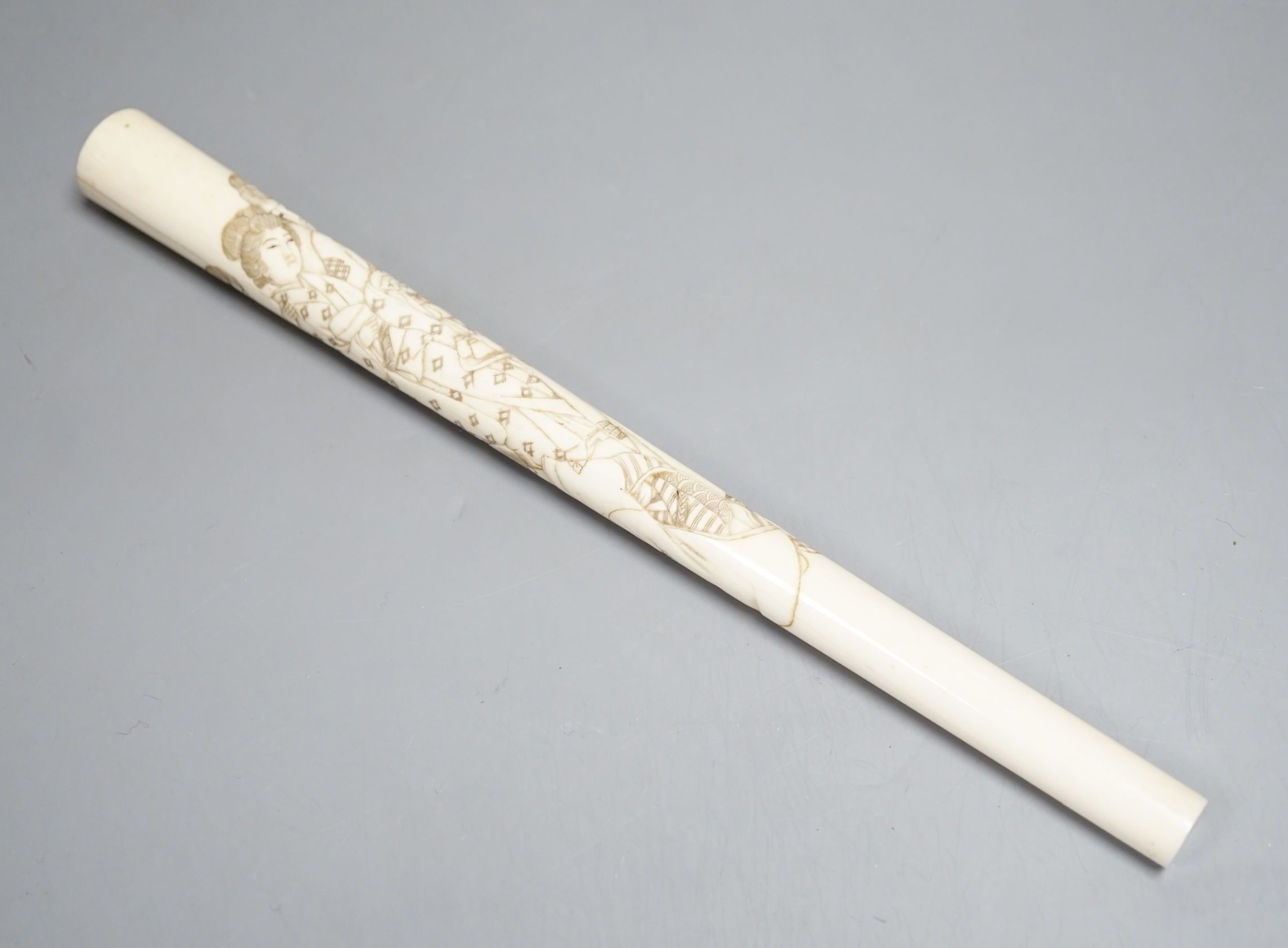 A 19th century Japanese carved ivory parasol handle 24.5cm