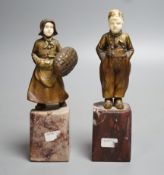 Two Art Deco gilt bronze and ivory Dutch youths, on marble plinths (one a.f) 15cm