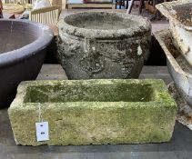 A circular reconstituted stone garden planter, diameter 38cm, height 32cm together with a smaller