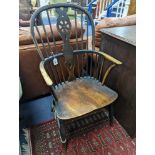 A 19th century elm and beech Windsor wheelback armchair, one leg a replacement, width 51cm, depth