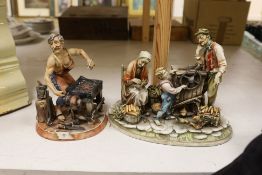 A Capodimonte figure group of a peasant family with organ grinder together with a smaller figure