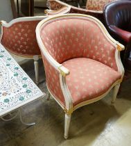 A pair of Louis XVI design painted parcel gilt tub framed chairs, width 65cm, depth 45cm, height