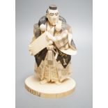 A Japanese ivory figure of a Yamabushi warrior monk, Taisho/early Showa period, signed to a