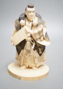 A Japanese ivory figure of a Yamabushi warrior monk, Taisho/early Showa period, signed to a