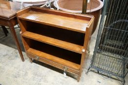 A reproduction Regency style mahogany graduated dwarf open bookcase, width 80 cm, depth 27 cm,