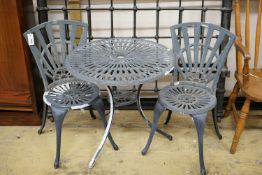 A painted aluminium circular garden table, diameter 69cm, height 66cm and two chairs