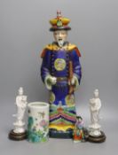 A Chinese brush pot, a pair of blanc de chine deities, a famille rose early 20th century figure, and