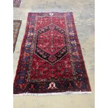 A Hamadan red ground rug, 220 x 130cm