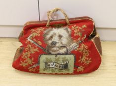 A 19th century Berlin beadwork and leather travel bag, designed one side with a King Charles Spaniel