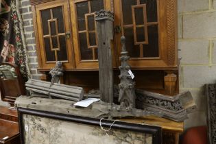 Seven Gothic style carved oak rail sections, largest height 144cm