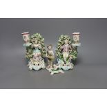 A pair of Derby bocage candlestick figures, c.1775, 17cm tall, a Bow cherub figure, c.1760 and a