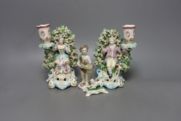 A pair of Derby bocage candlestick figures, c.1775, 17cm tall, a Bow cherub figure, c.1760 and a