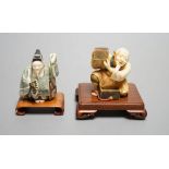 Two Japanese stained ivory okimono-netsuke of a priest and a man with a box, Taisho/early Showa