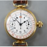 A gentleman's early 20th century 18k single button chronograph manual wind wrist watch, with