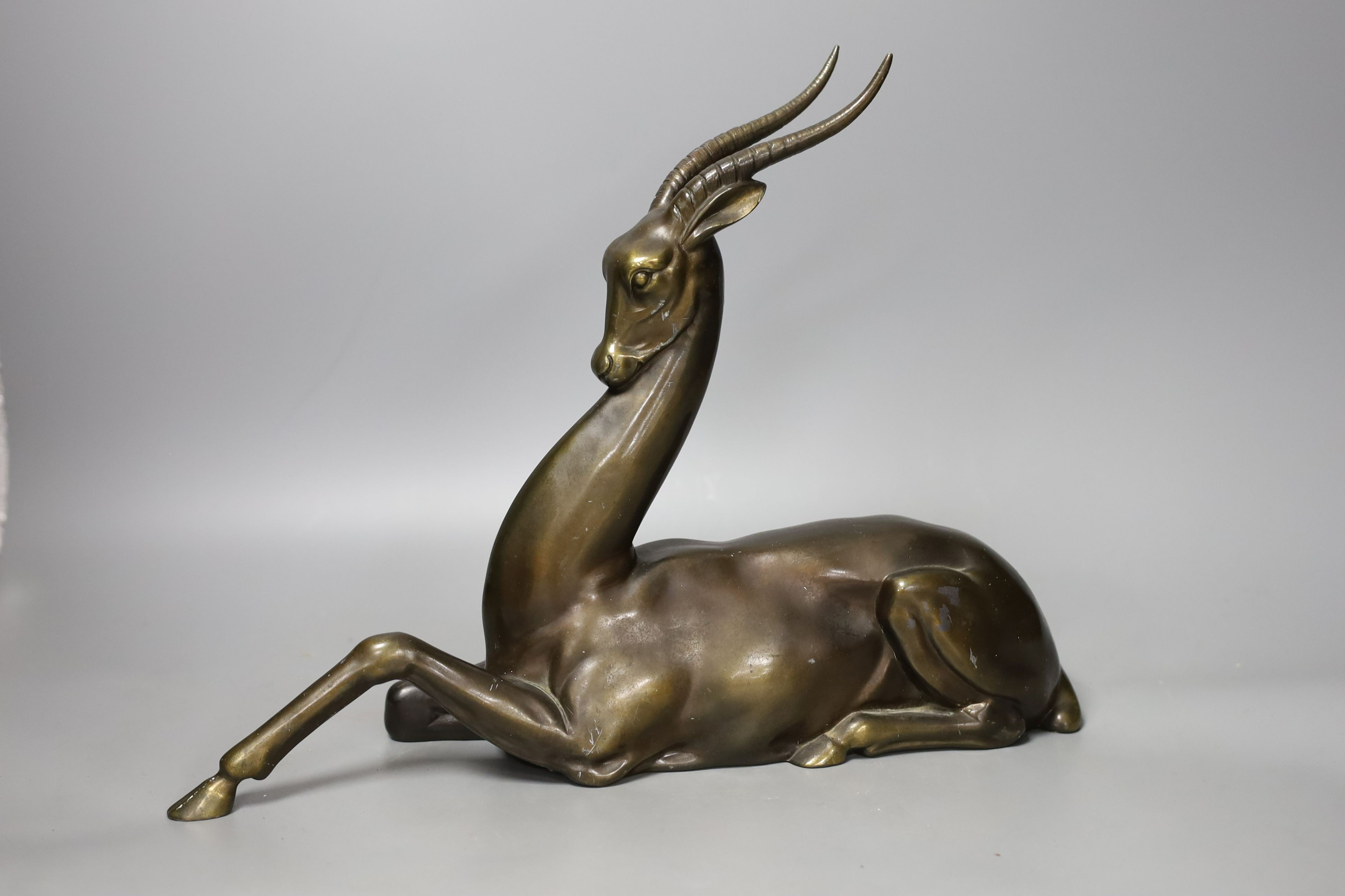 An Art Deco bronze-finished spelter gazelle - 28cm tall