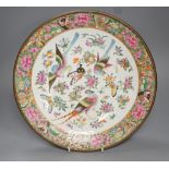 A 19th century Chinese famille rose ‘birds insects fruit and flowers’ dish - 35cm diameter