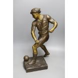 A bronzed spelter figure of a footballer after Picault - 50cm tall