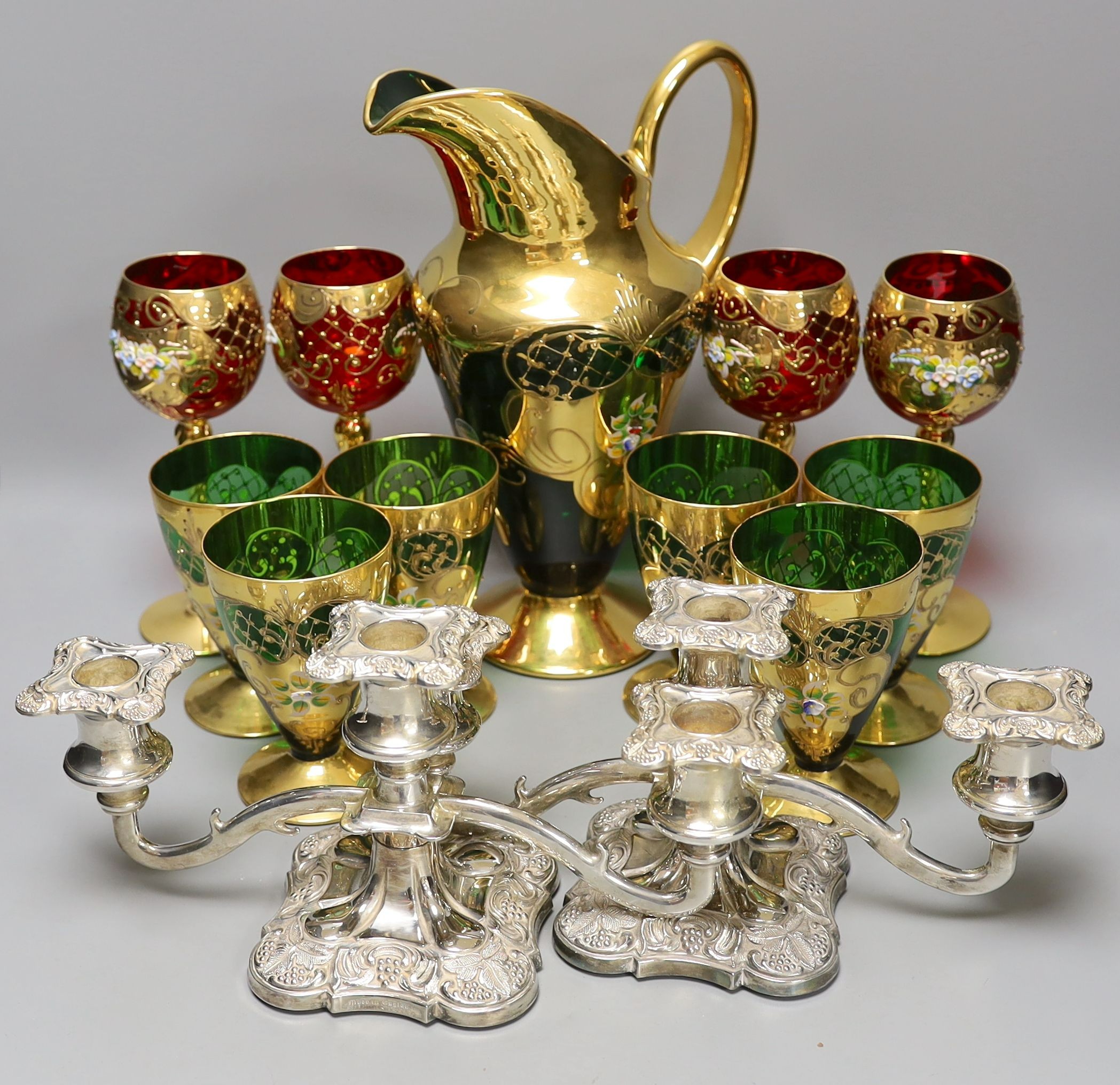 A Venetian green glass lemonade set, 4 red glass wine glasses and a pair of plated candelabra,jug 29
