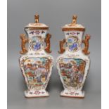 A pair of 18th century Chinese export square form famille rose vases and covers with phoenix handles