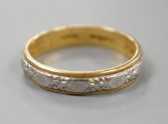 A modern 18ct two colour gold band, size L,3.6 grams.