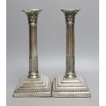 A pair of late Victorian silver Corinthian column candlesticks, maker's mark rubbed, London, 1890,