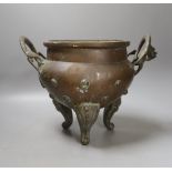 An Oriental two handled elephant footed bronze bowl,24 cms high not including handles.