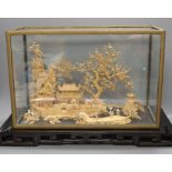 A large Chinese export Ruanmu Hua carved cork diorama, depicting a pagoda on stand - 35.5cm tall
