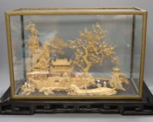 A large Chinese export Ruanmu Hua carved cork diorama, depicting a pagoda on stand - 35.5cm tall