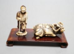 Two Japanese stag antler carvings - a Tomotada style ox netsuke, 7cm long, and a lady, 6.5cm